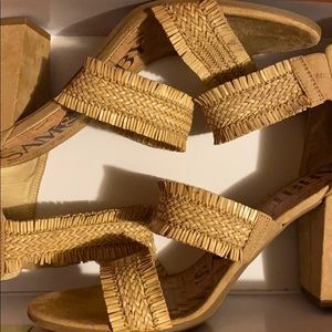 Tan pumps/heels with straps.